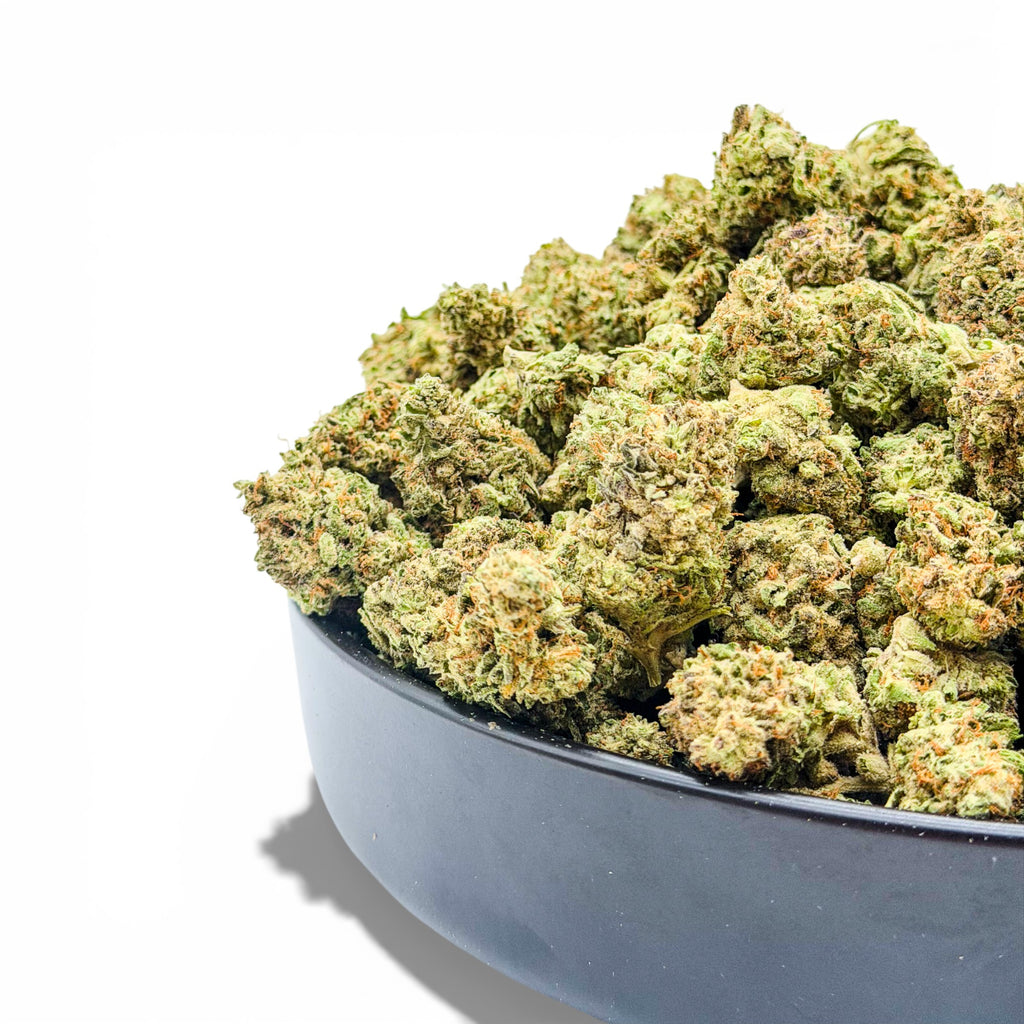 Bowl filled with green cannabis buds on a white background showing wholesale THCa flower from Dr. Wonderstone