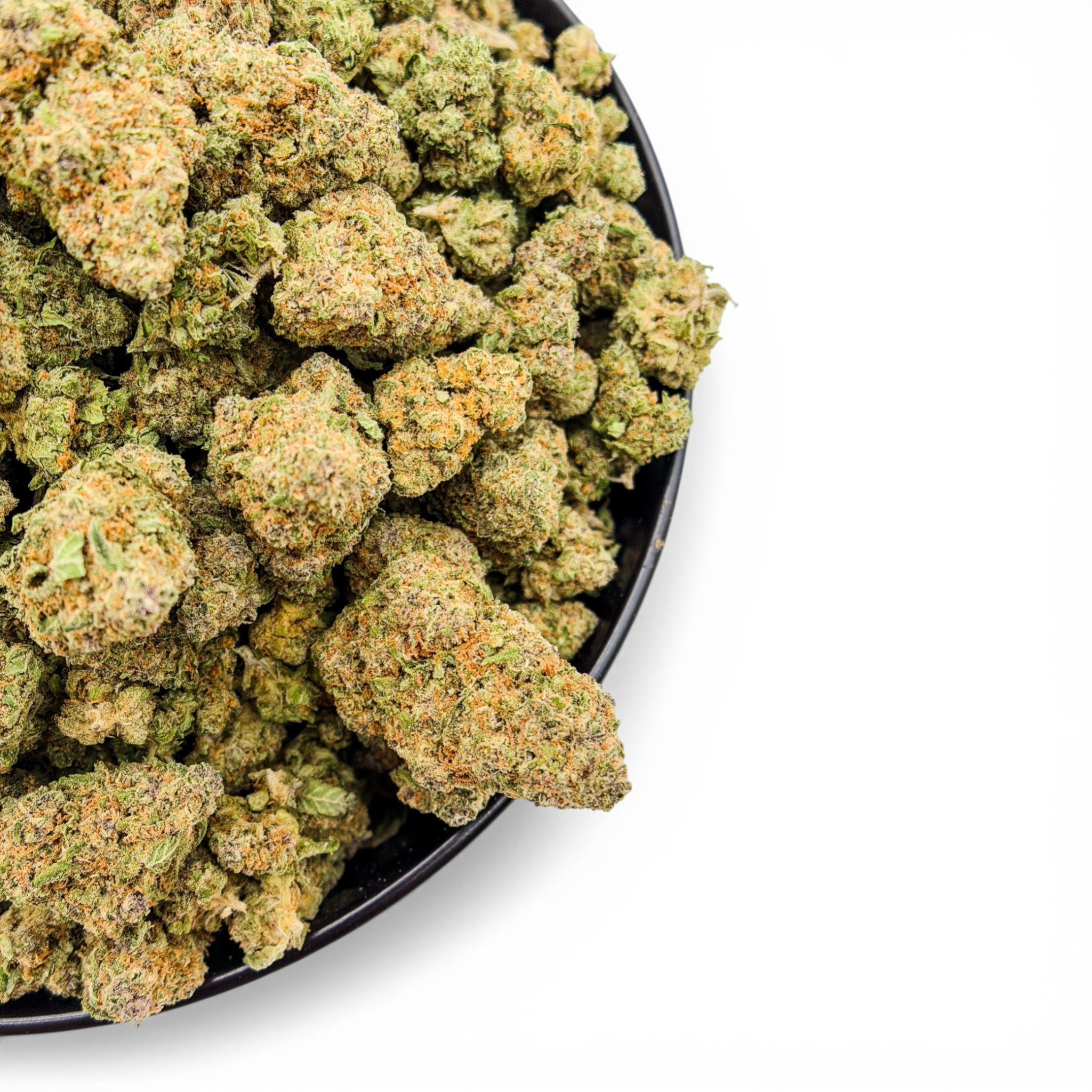 Close-up of Tree Flip THCa cannabis buds in a black bowl on a white background from Dr. Wonderstone in Chattanooga, TN.