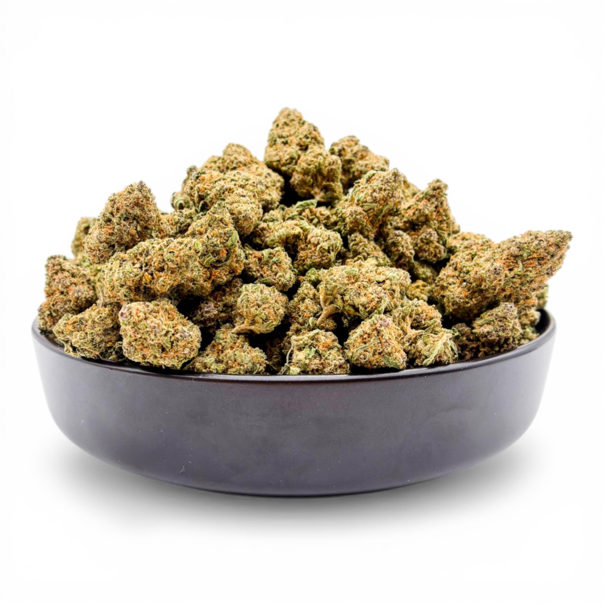 Bowl filled with cannabis buds on a white background