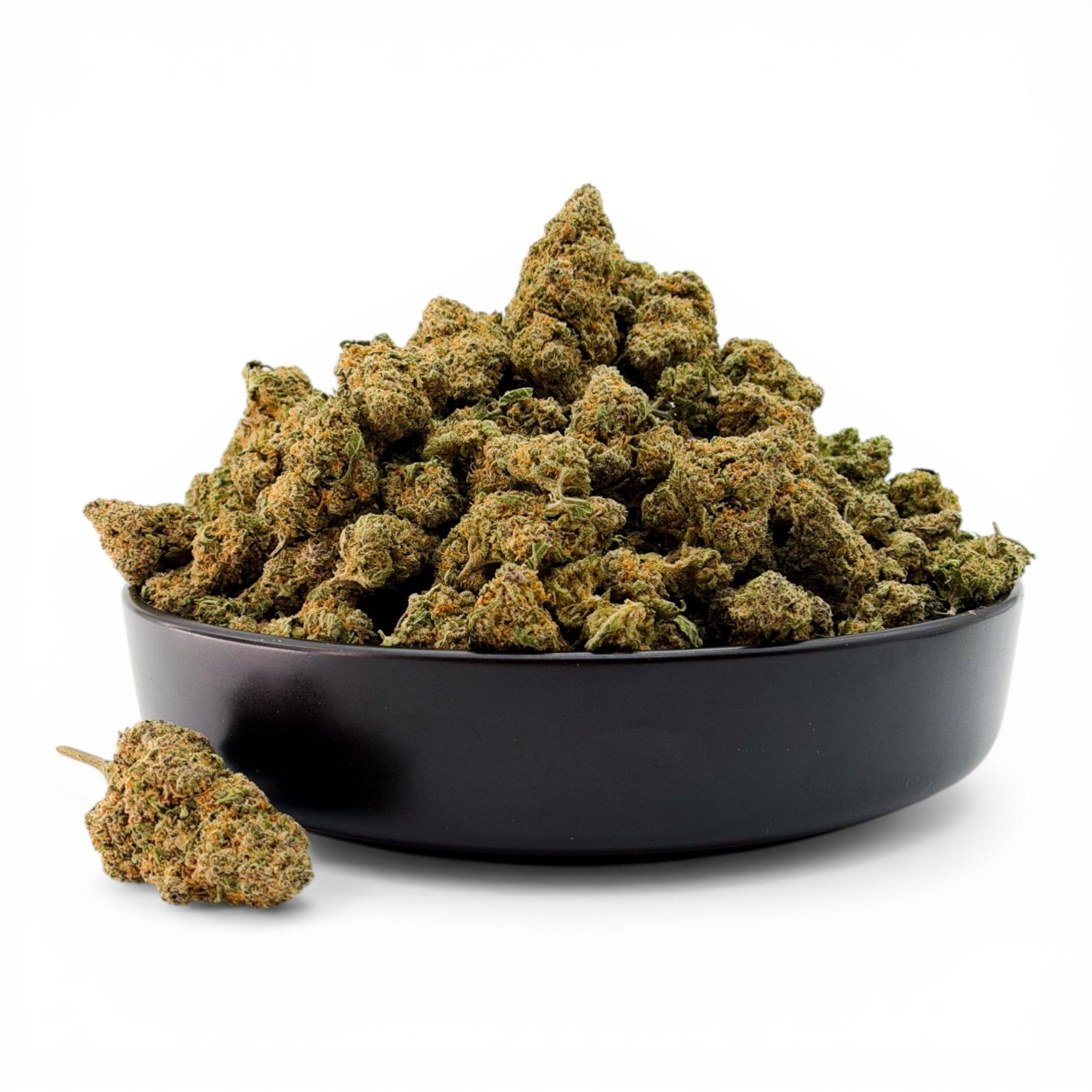 Black bowl filled with green cannabis buds on a white background