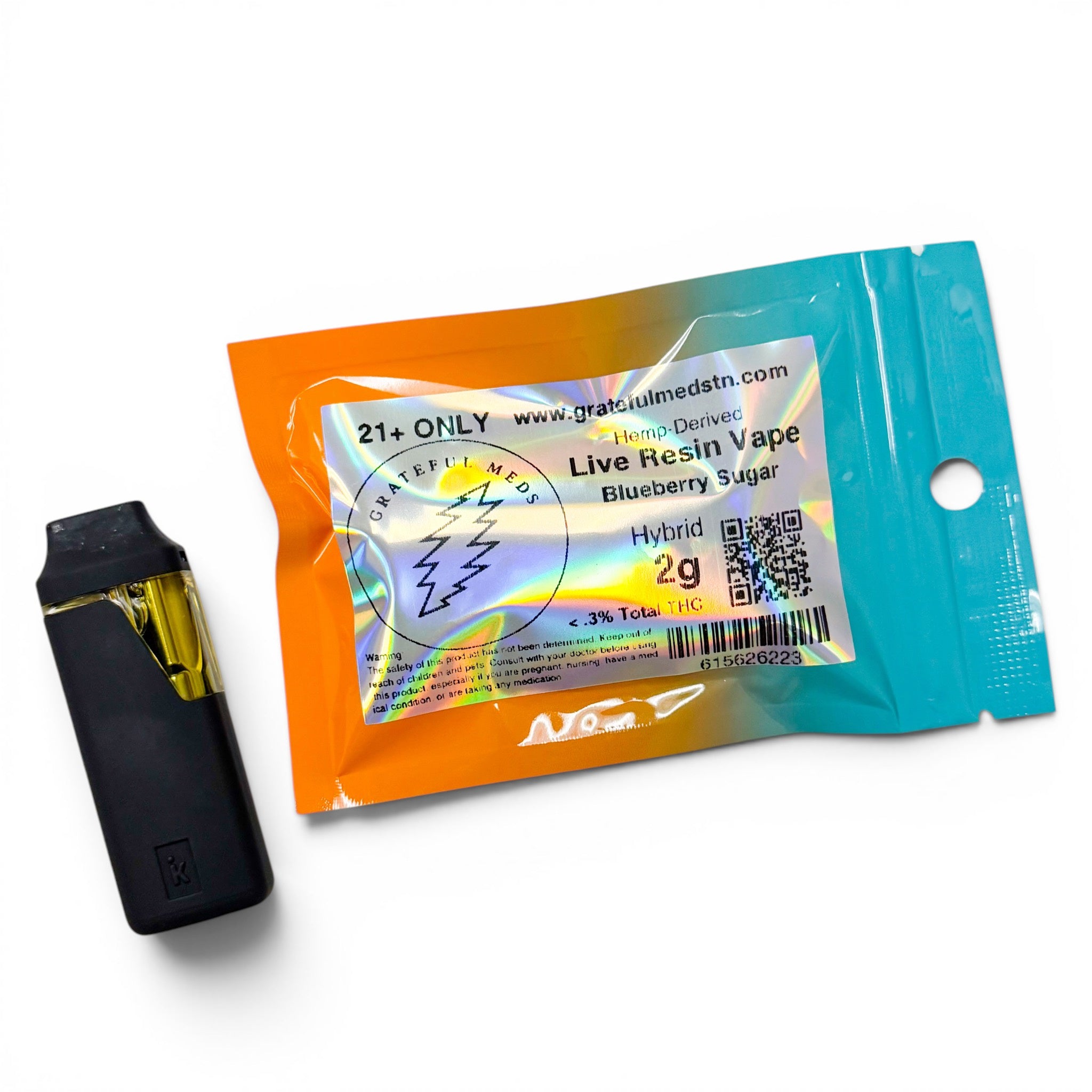 A black hybrid vape device with a gold mouthpiece shown next to its retail packaging. The packaging is a resealable pouch with a bright orange-to-blue gradient and a holographic label that reads 'Gratulmedsn' and 'Live Resin Vape Blueberry Sugar 2g'.