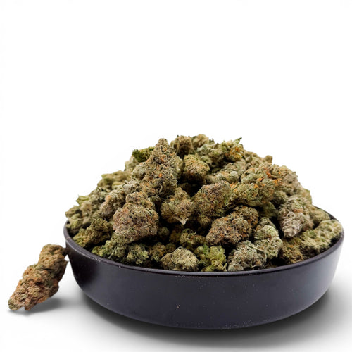 Dr. Wonderstone Alien Wedding THCa flower in a black bowl, featuring dense green buds with orange pistils and trichomes.