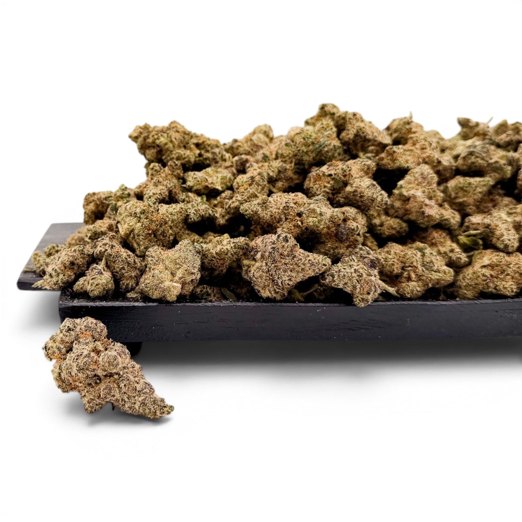 Dr. Wonderstone Blueberry Muffin THCa flower buds with a sugar-coated, dense texture on a black display tray.