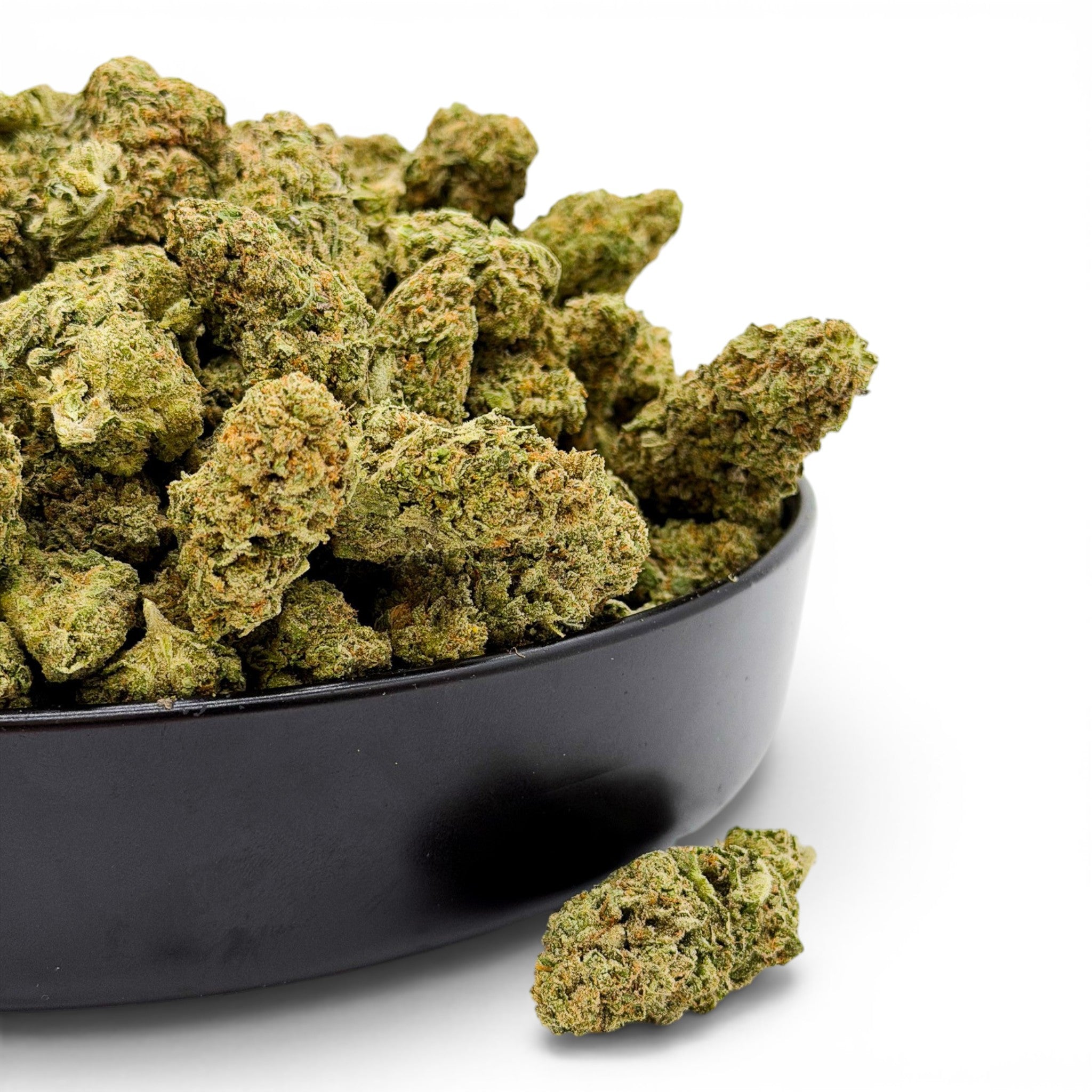 Dr. Wonderstone Bubble Gum premium indoor THCa flower buds with dense structure and orange pistils in a black bowl.