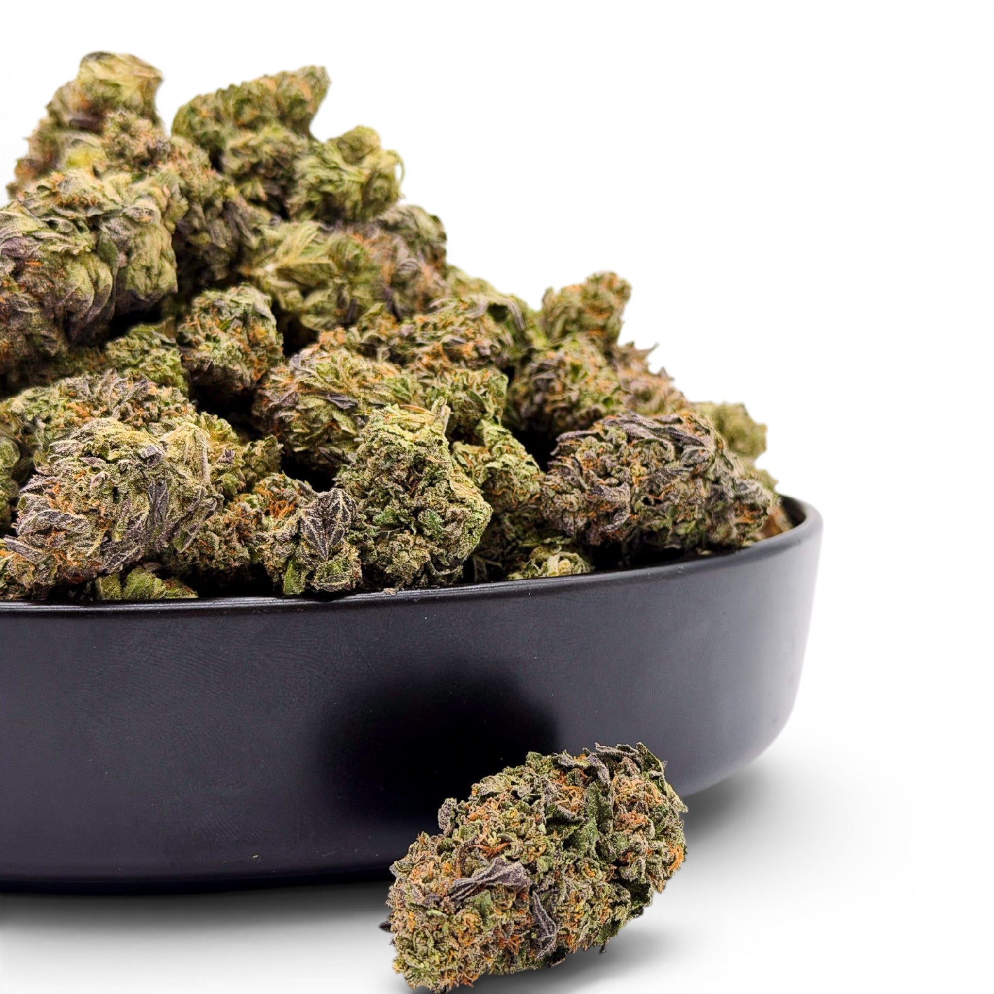 Dr. Wonderstone Cosmic Runtz indoor THCa flower buds with green and purple hues in a black bowl. Buy bulk Cannabis Flower for your retail store.