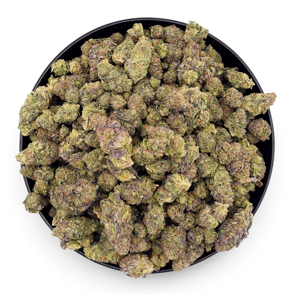 Dr. Wonderstone Cosmic Runtz premium indoor THCa flower with dense, trichome-rich green and purple buds in a bowl.