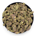 Dr. Wonderstone Cosmic Runtz premium indoor THCa flower with dense, trichome-rich green and purple buds in a bowl.