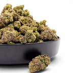 Dr. Wonderstone Cosmic Runtz premium indoor THCa flower in a black bowl, showing dense green and purple resin-rich buds.