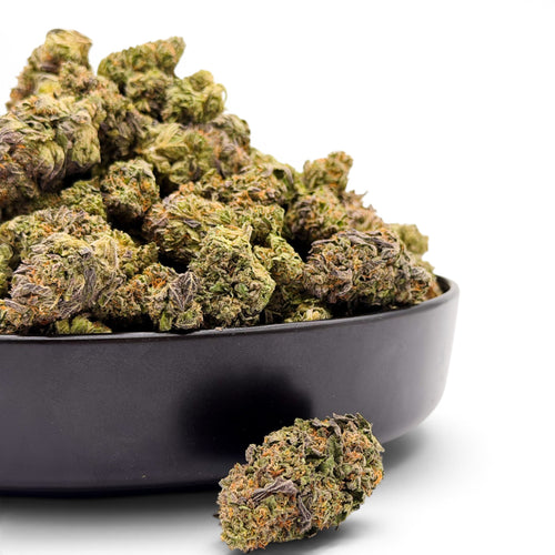 Dr. Wonderstone Cosmic Runtz premium indoor THCa flower in a black bowl, showing dense green and purple resin-rich buds.
