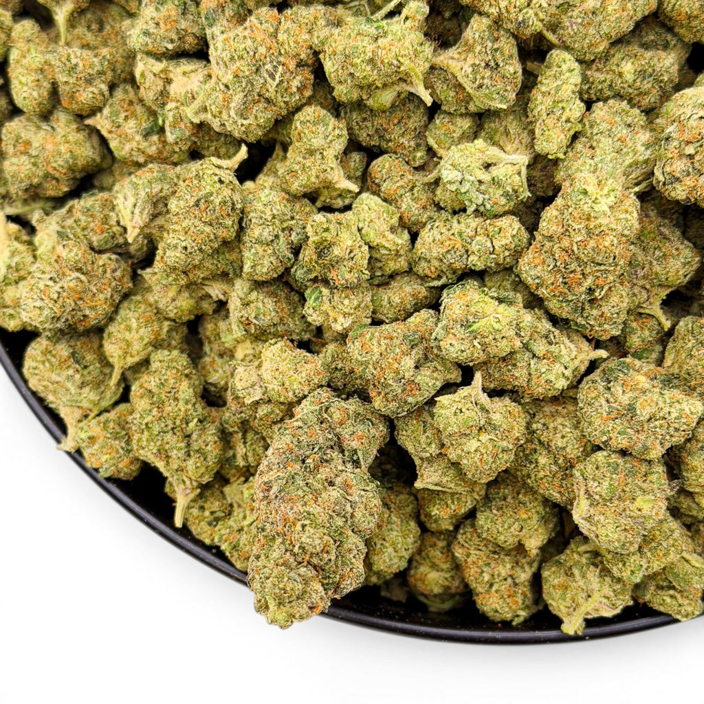 Dr. Wonderstone Elektra Ice THCa flower buds with frosty green texture and orange pistils in a black bowl