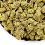 Dr. Wonderstone Elektra Ice THCa flower buds with frosty green texture and orange pistils in a black bowl