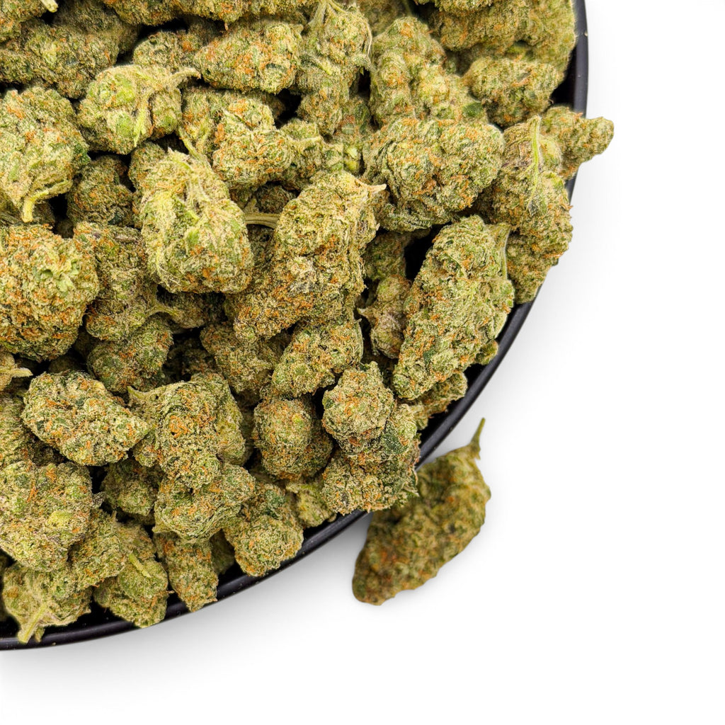 Dr. Wonderstone Elektra Ice THCa flower buds with dense green texture and orange pistils in a black bowl.