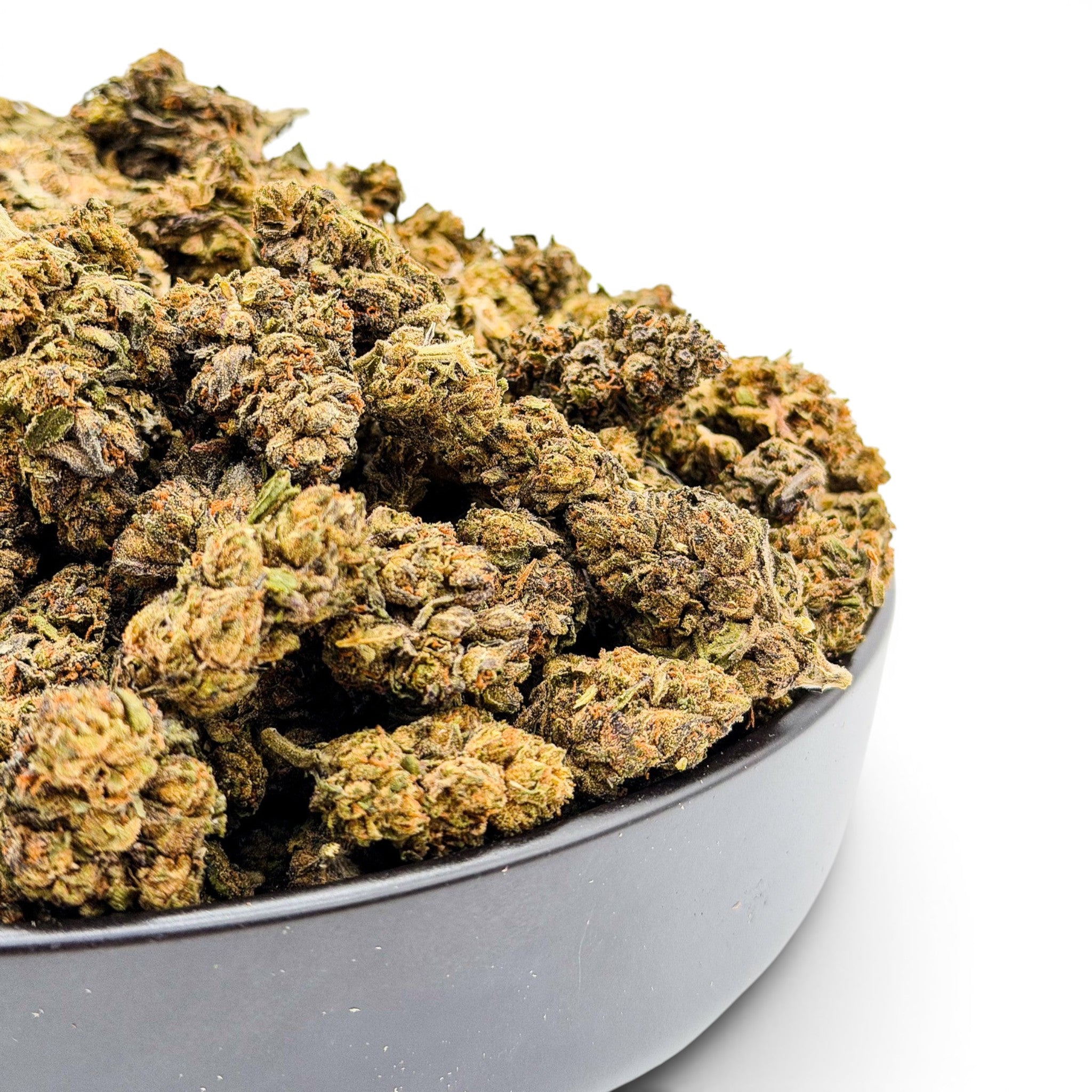 Dr. Wonderstone Gelato Fuel indoor THCa flower buds with green and orange hues in a black bowl.
