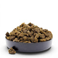 Dr. Wonderstone Gelato Fuel indoor THCa flower buds piled in a black bowl against a white background.