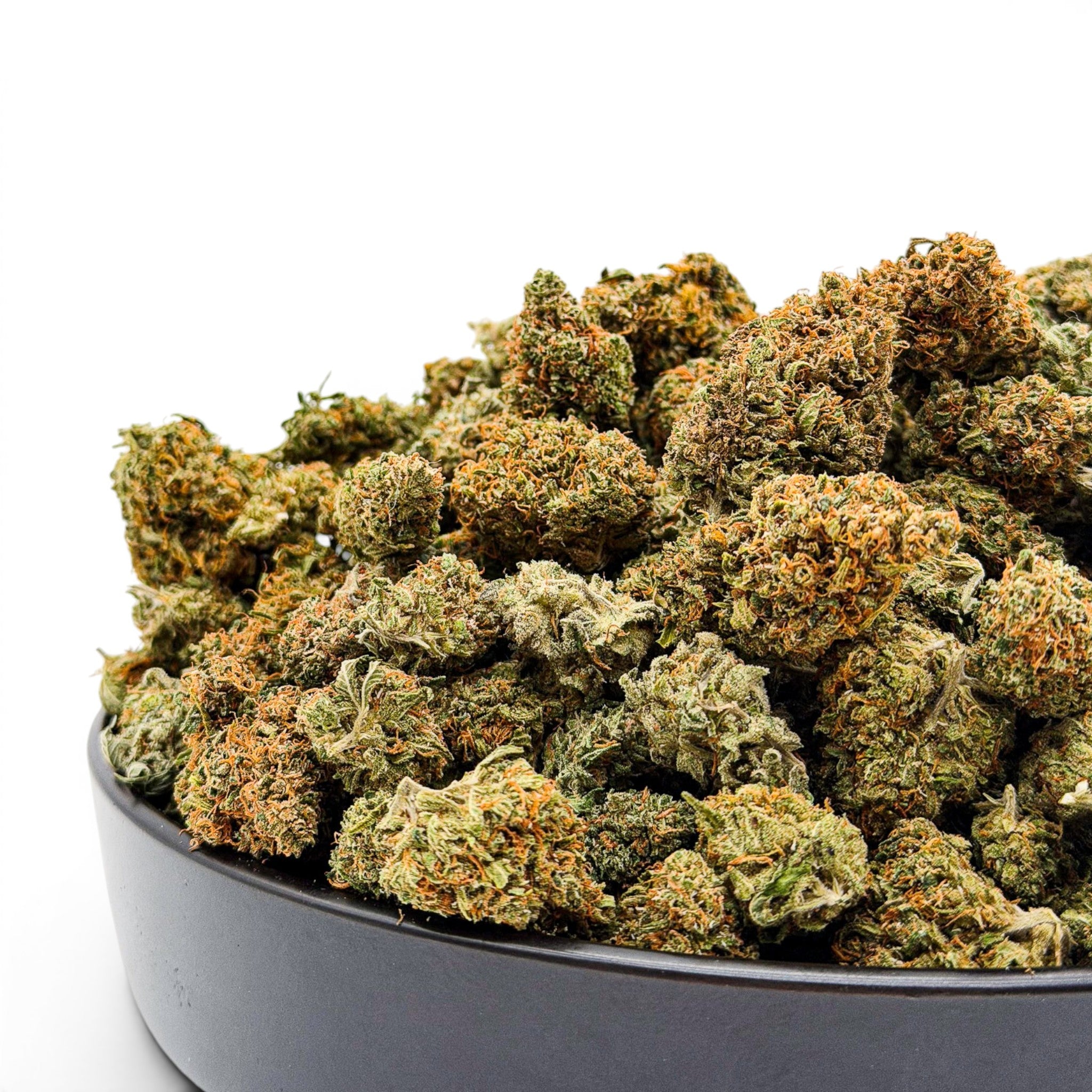 Dr. Wonderstone Goat Gas premium THCa flower buds with green and orange trichomes in a black bowl.