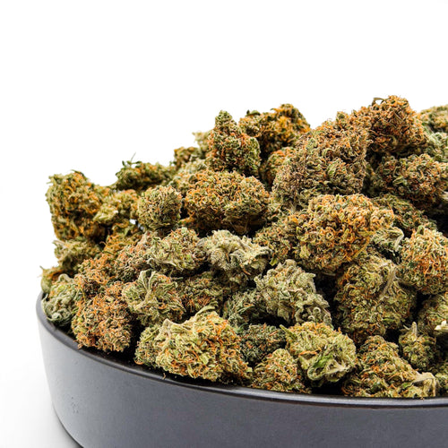 Dr. Wonderstone Goat Gas premium THCa flower buds with green and orange trichomes in a black bowl.