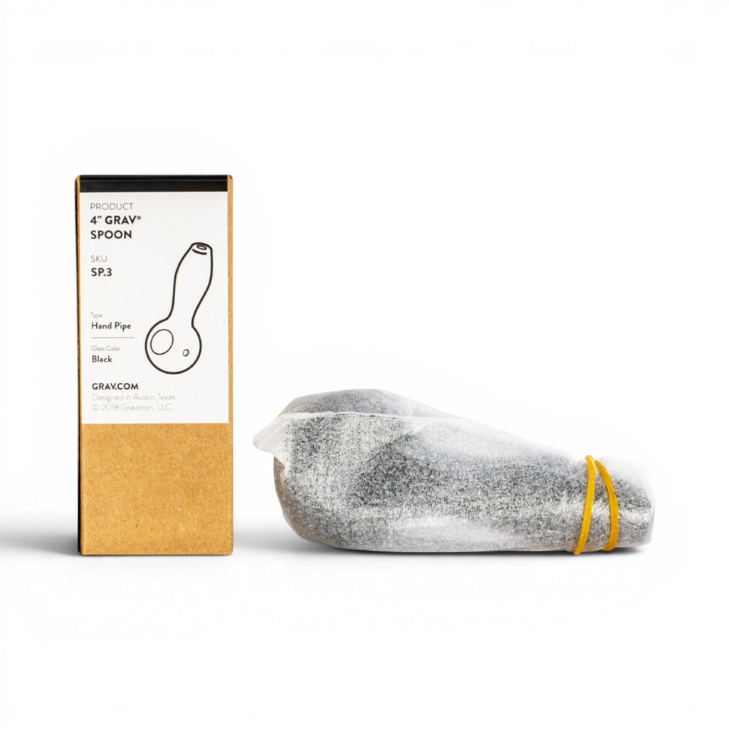 Dr. Wonderstone GRAV Classic Spoon hand pipe in black glass, packaged in a box with protective wrapping.