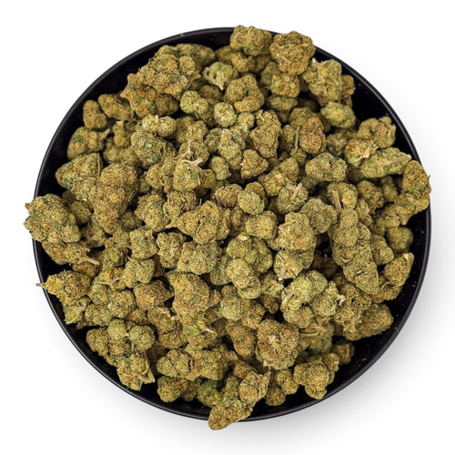 Dr. Wonderstone Green Crack THCa flower buds in a black bowl, featuring dense, light green sativa nugs.