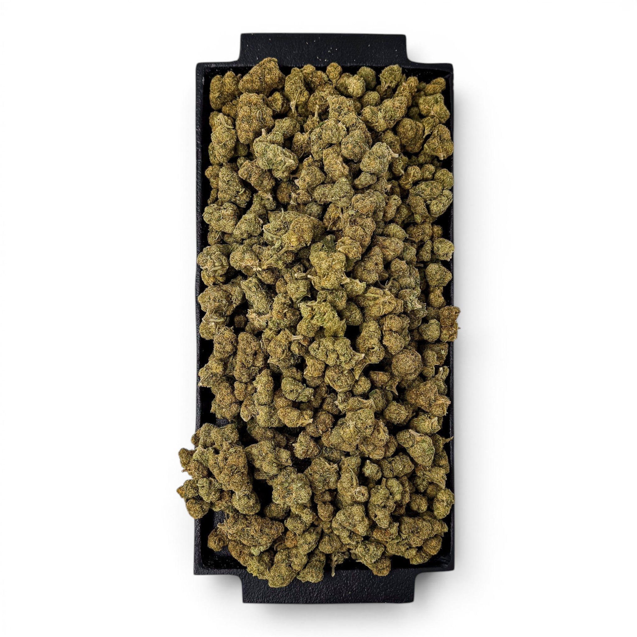 Dr. Wonderstone Green Crack THCa flower buds piled on a black rectangular tray, showcasing dense, earthy green nugs.