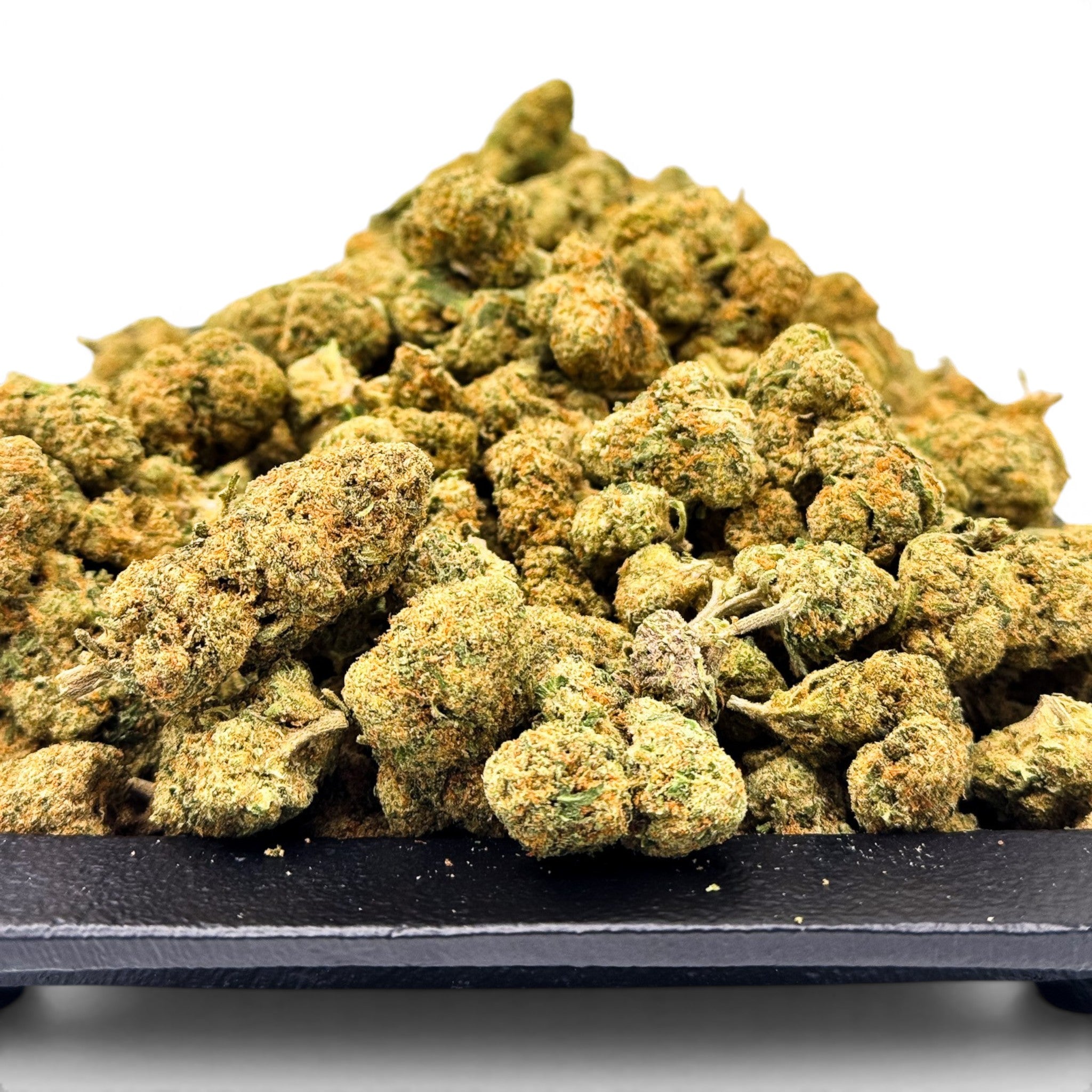 Dr. Wonderstone Green Crack THCa flower buds featuring dense, light green nugs with orange pistils on a black tray.