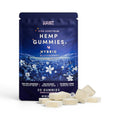 Dr. Wonderstone Habit High Spectrum blackberry hemp gummies in a dark blue pouch with a pile of sugar-coated gummies.