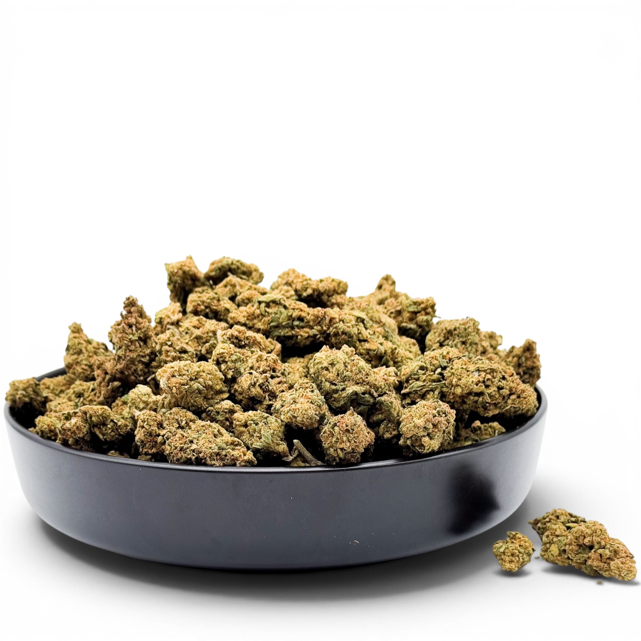 Dr. Wonderstone Jack Herer THCa flower buds in a black bowl, featuring dense green nugs with orange pistils.