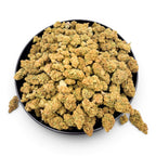 Dr. Wonderstone Jack Herer THCa flower buds in a black bowl, featuring bright green nugs with orange pistils.