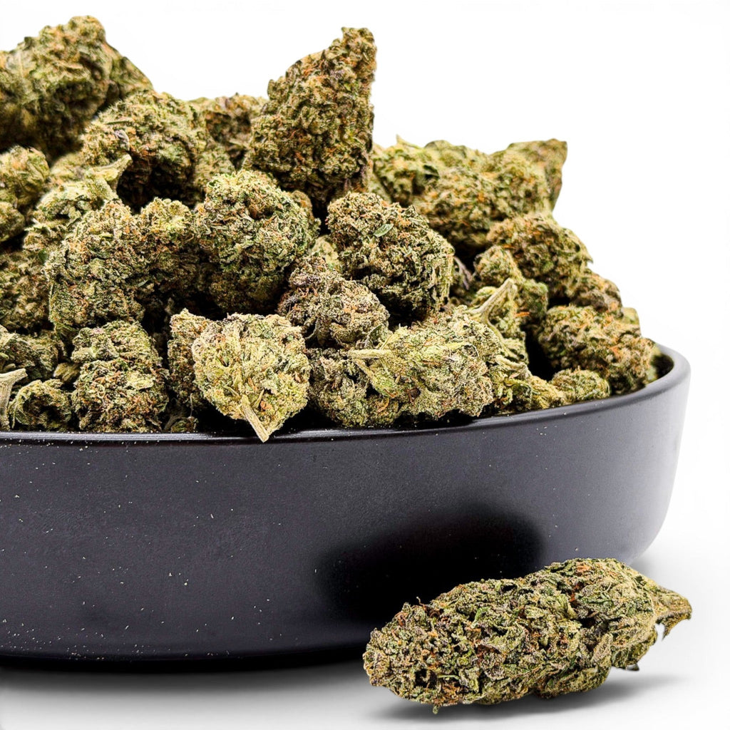 Buy THCa Flower Online with Dr. Wonderstone Jet Fuel Gelato premium THCa flower buds with green and purple hues in a black bowl.