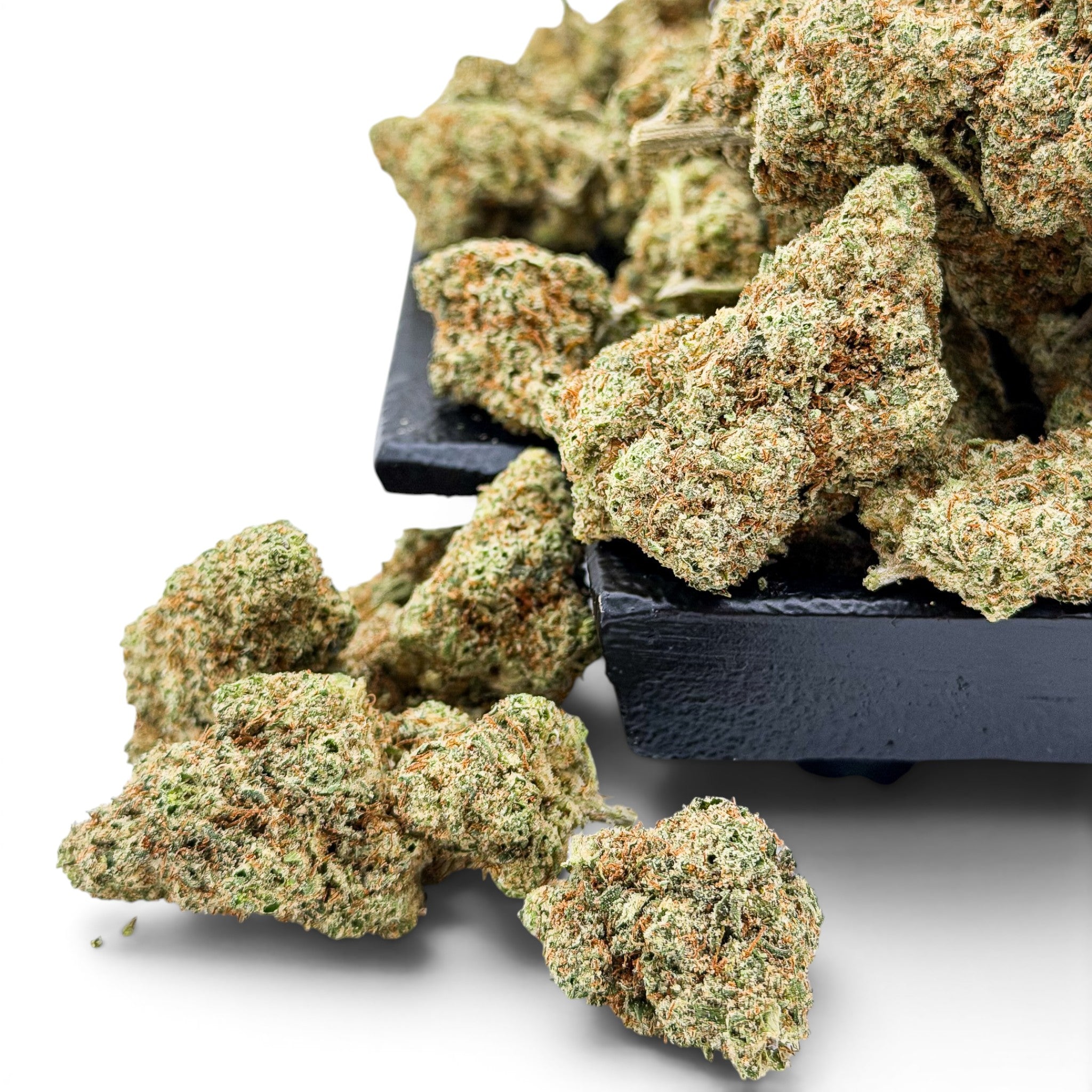 Dr. Wonderstone London Pound Cake THCa flower buds with frosty trichomes and orange pistils on a black tray.