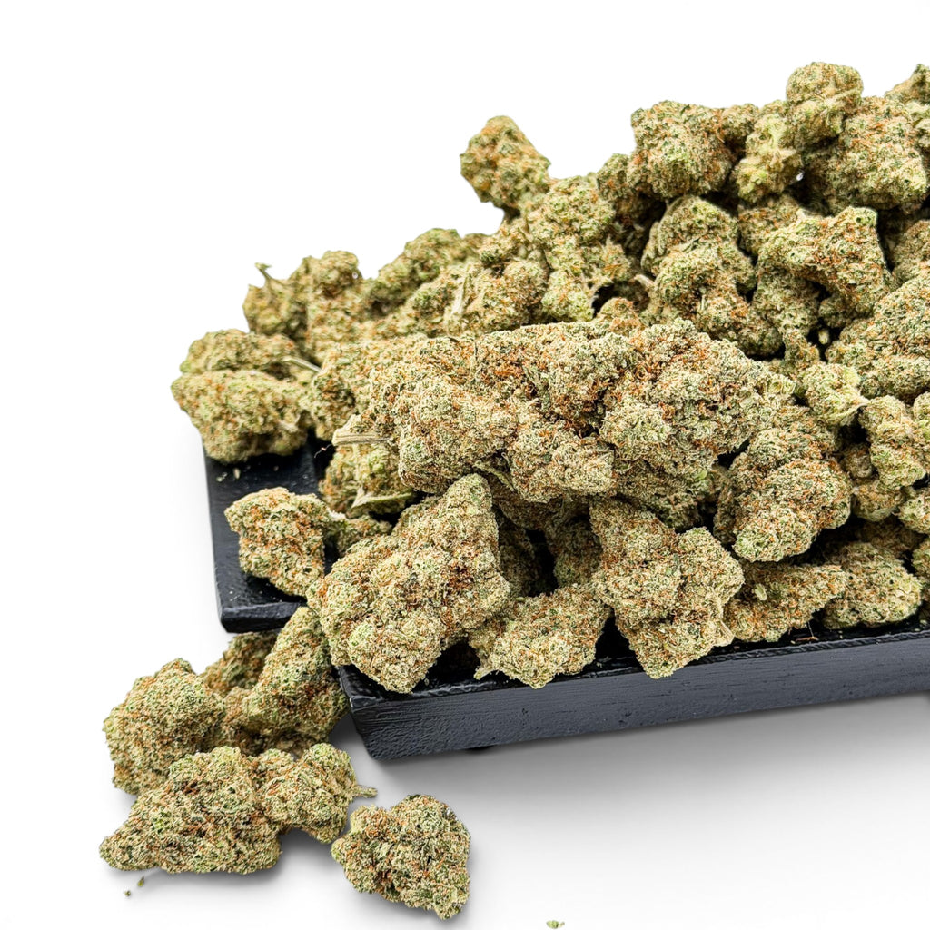 Dr. Wonderstone London Pound Cake THCa flower featuring dense, frosty green buds with orange pistils on a black tray.