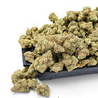Dr. Wonderstone London Pound Cake THCa flower featuring dense, frosty green buds with orange pistils on a black tray.