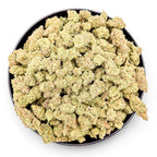 Dr. Wonderstone MAC-1 hybrid THCa flower in a black bowl, featuring frosty, resin-dense light green cannabis buds.