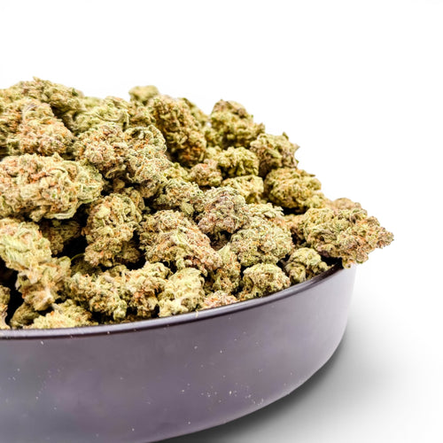 Dr. Wonderstone MAC-1 THCa flower buds in a black bowl, featuring frosty green resin-dense texture.