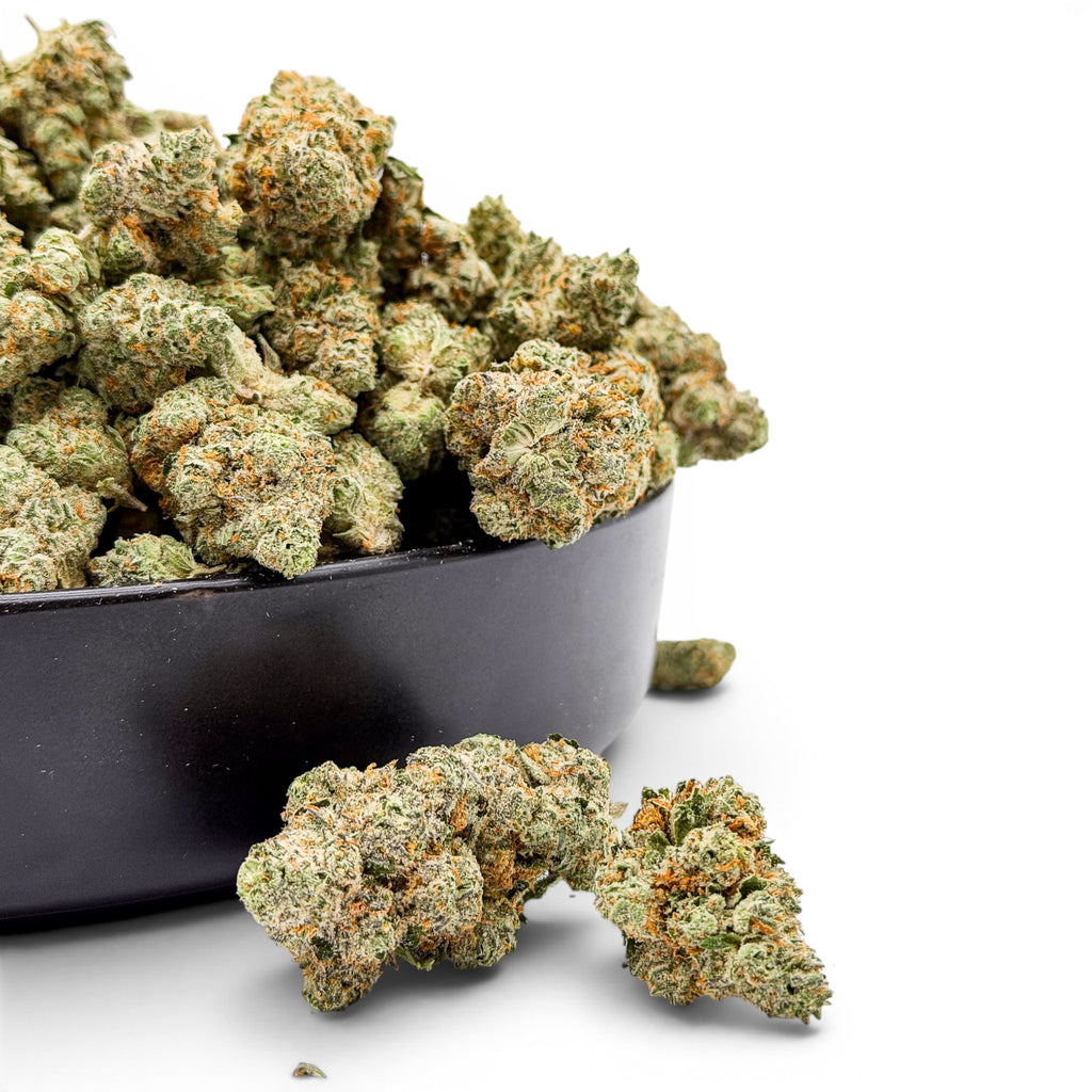 Dr. Wonderstone Modified Grapes hybrid THCa flower buds with purple hues and orange pistils in a black bowl.