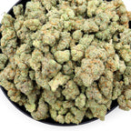 Dr. Wonderstone Modified Grapes THCa flower featuring dense, resinous green buds with purple hues and orange pistils.