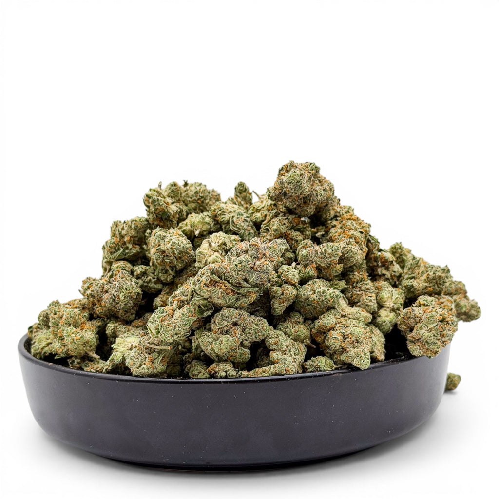 Dr. Wonderstone Modified Grapes THCa flower buds in a black bowl, featuring dense green and purple resinous nugs.