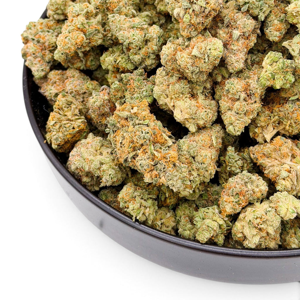 Dr. Wonderstone Orange Blueberry Muffin indoor THCa flower with dense green buds, orange pistils, and trichome coverage.