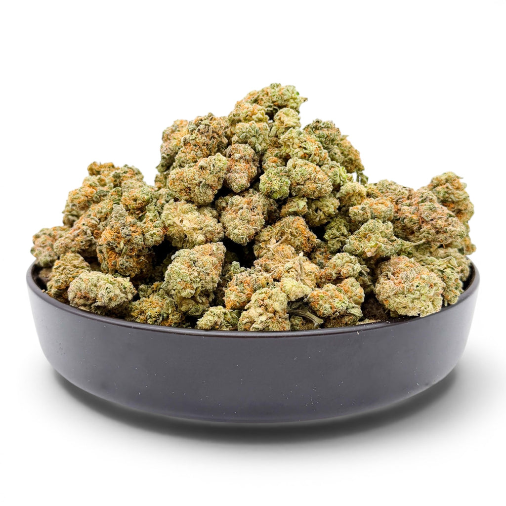 Dr. Wonderstone Orange Blueberry Muffin premium indoor THCa flower buds in a black bowl with orange pistils and trichomes