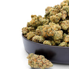 Dr. Wonderstone Orange Blueberry Muffin THCa flower buds in a black bowl, showing dense green nugs with orange pistils.