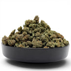 Dr. Wonderstone Pancakes premium THCa flower buds piled in a black bowl against a white background.
