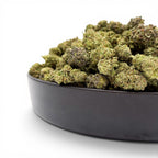 Dr. Wonderstone Pineapple hybrid THCa flower buds with dense green structure and trichome coverage in a black bowl