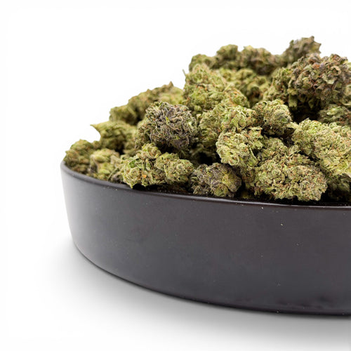 Dr. Wonderstone Pineapple hybrid THCa flower buds with dense green structure and trichome coverage in a black bowl
