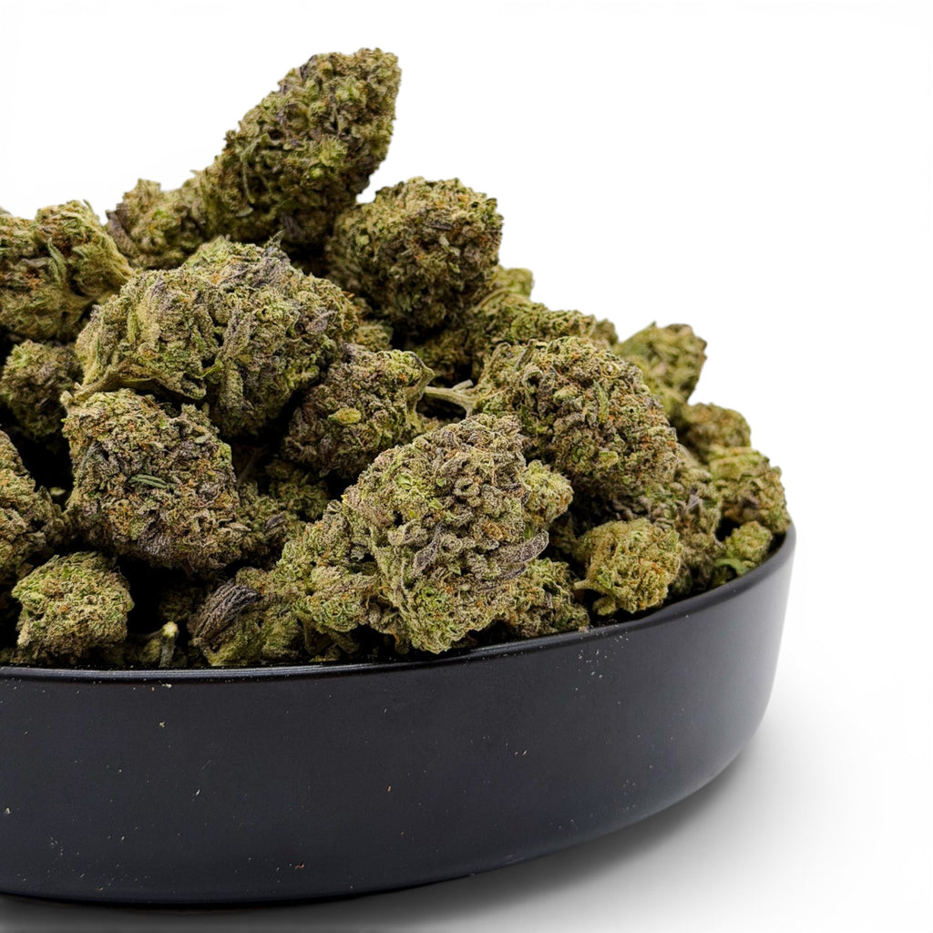 Dr. Wonderstone Pink Kush premium indoor THCa flower buds with dense green structure and orange pistils in a black bowl