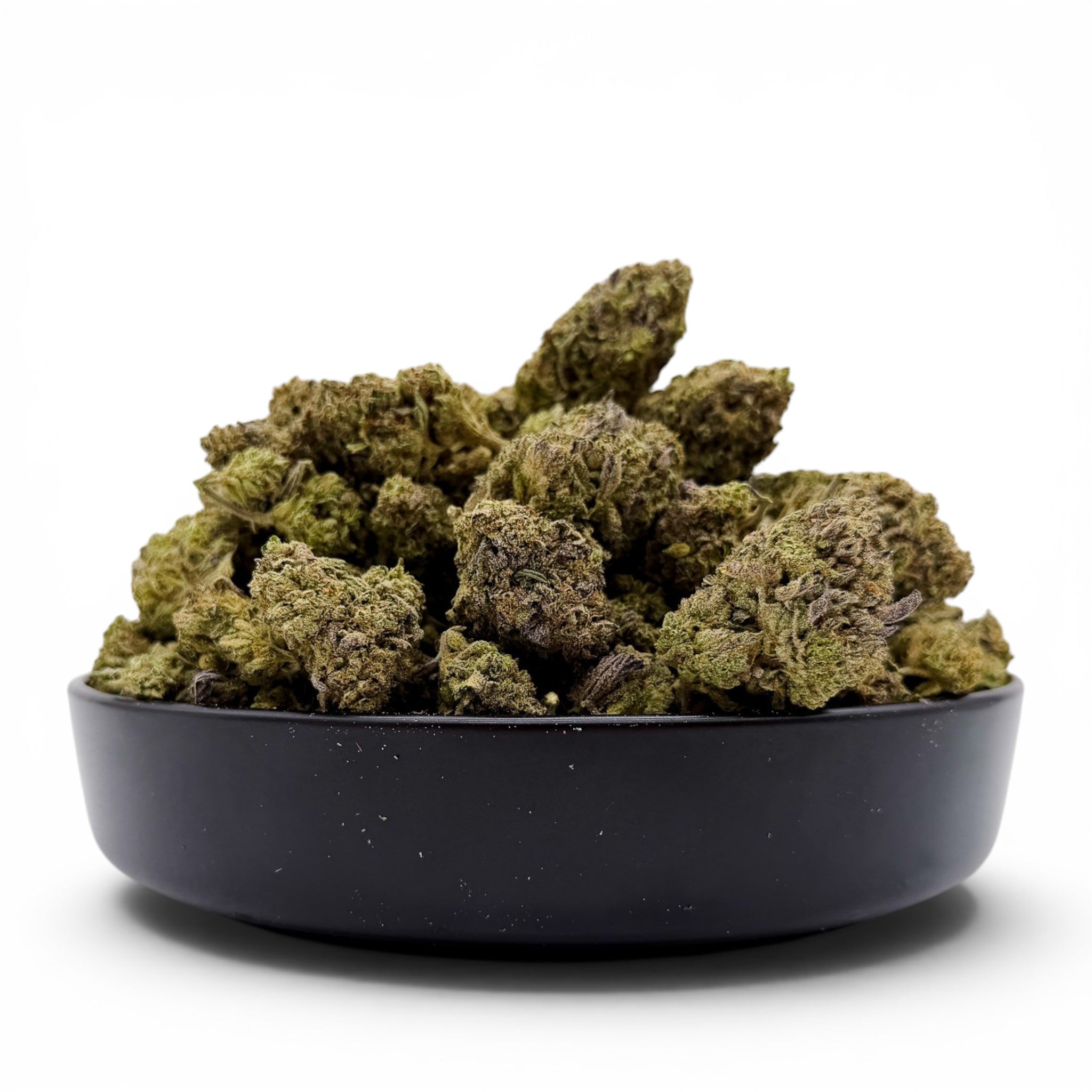 Dr. Wonderstone Pink Kush premium indoor THCa flower buds in a black bowl with dense green structure and orange pistils.