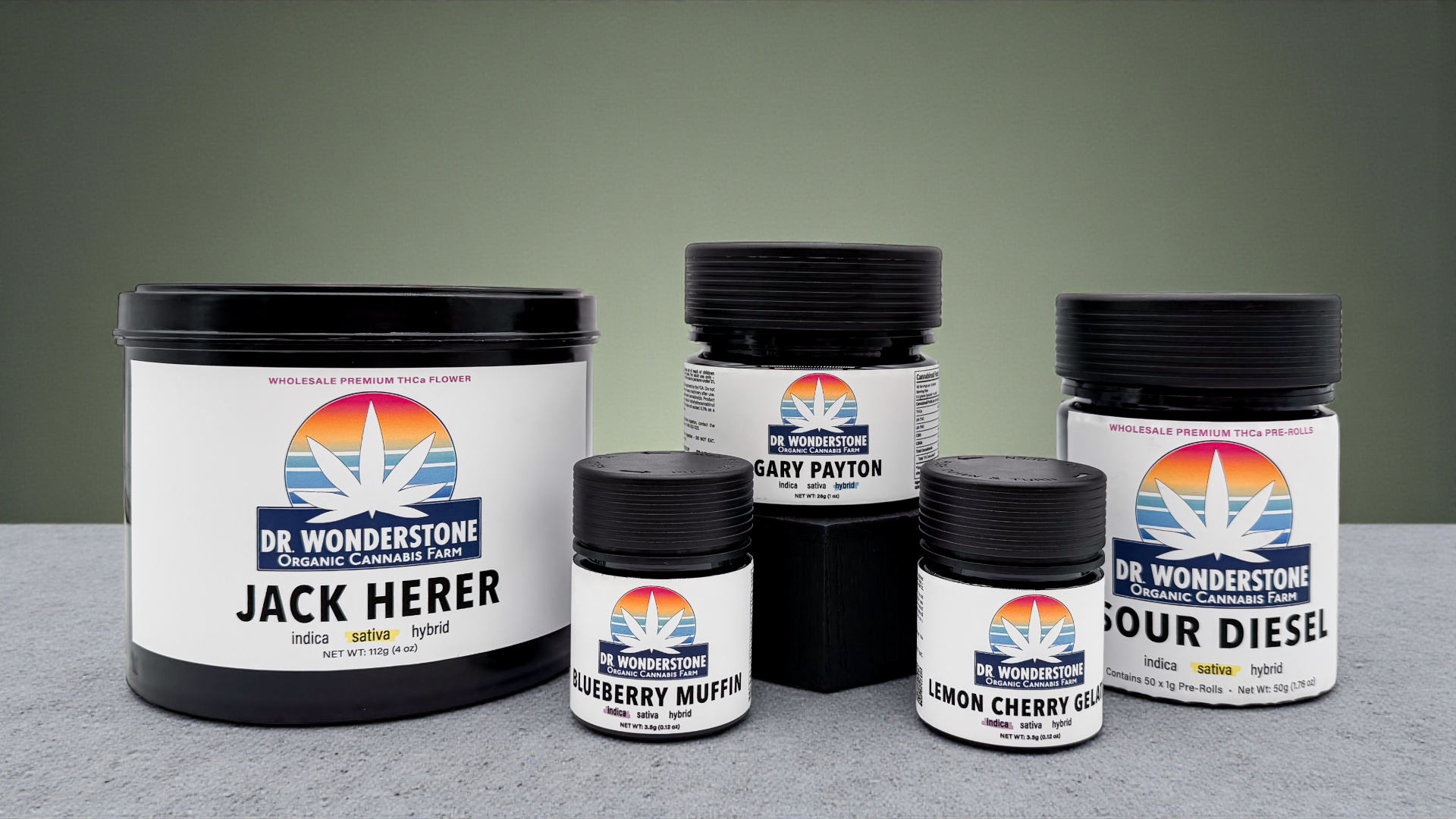 Collection of Dr. Wonderstone cannabis product jars on a gray surface with a green background