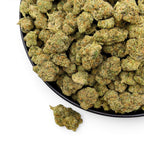 Dr. Wonderstone Purple Rhino exotic THCa flower buds in a black bowl on a white background