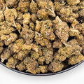 Dr. Wonderstone Runtz premium THCa flower buds featuring dense green and purple foliage with orange pistils.