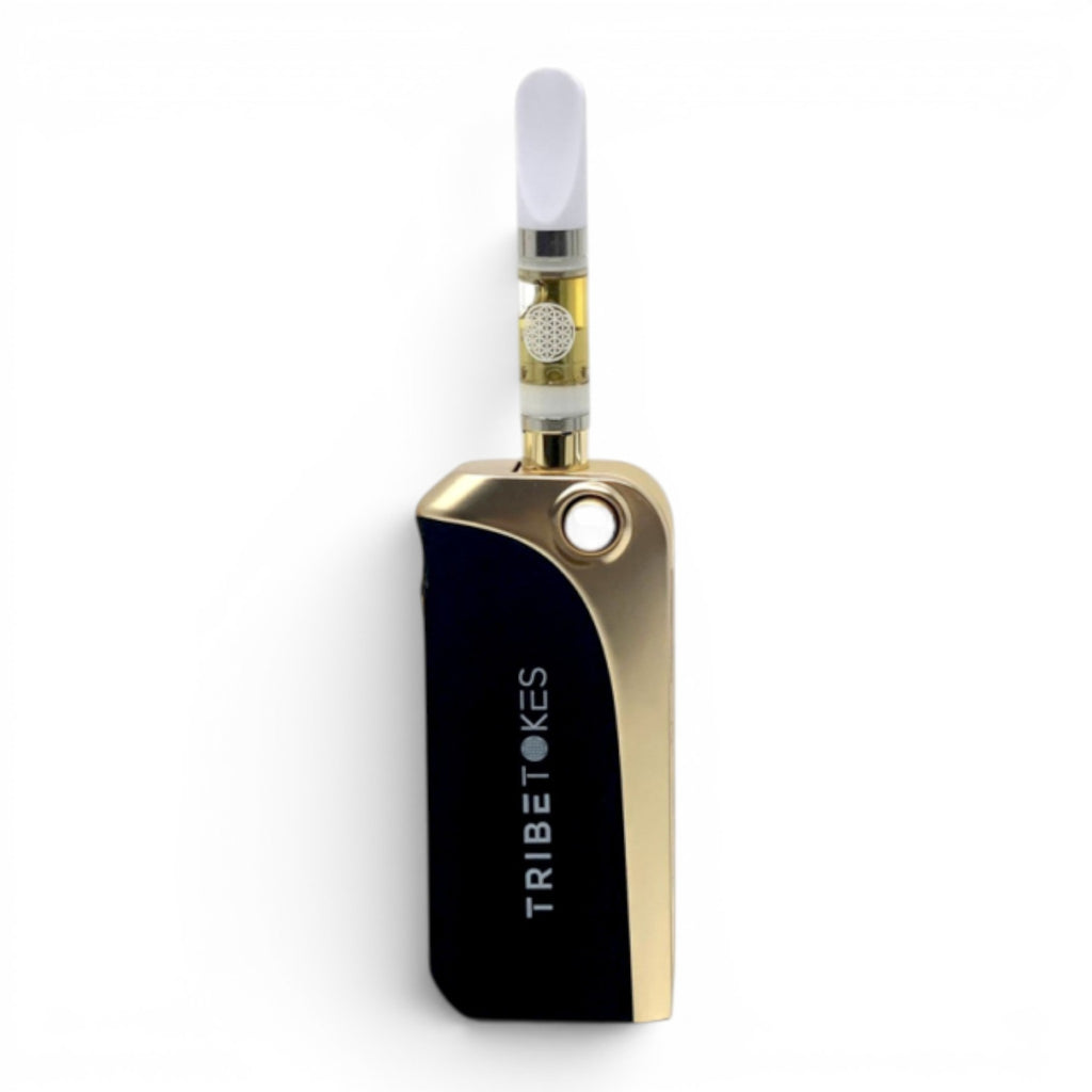 Dr. Wonderstone TribeTokes Saber black and gold car key style 510 vape battery with a cartridge popped out