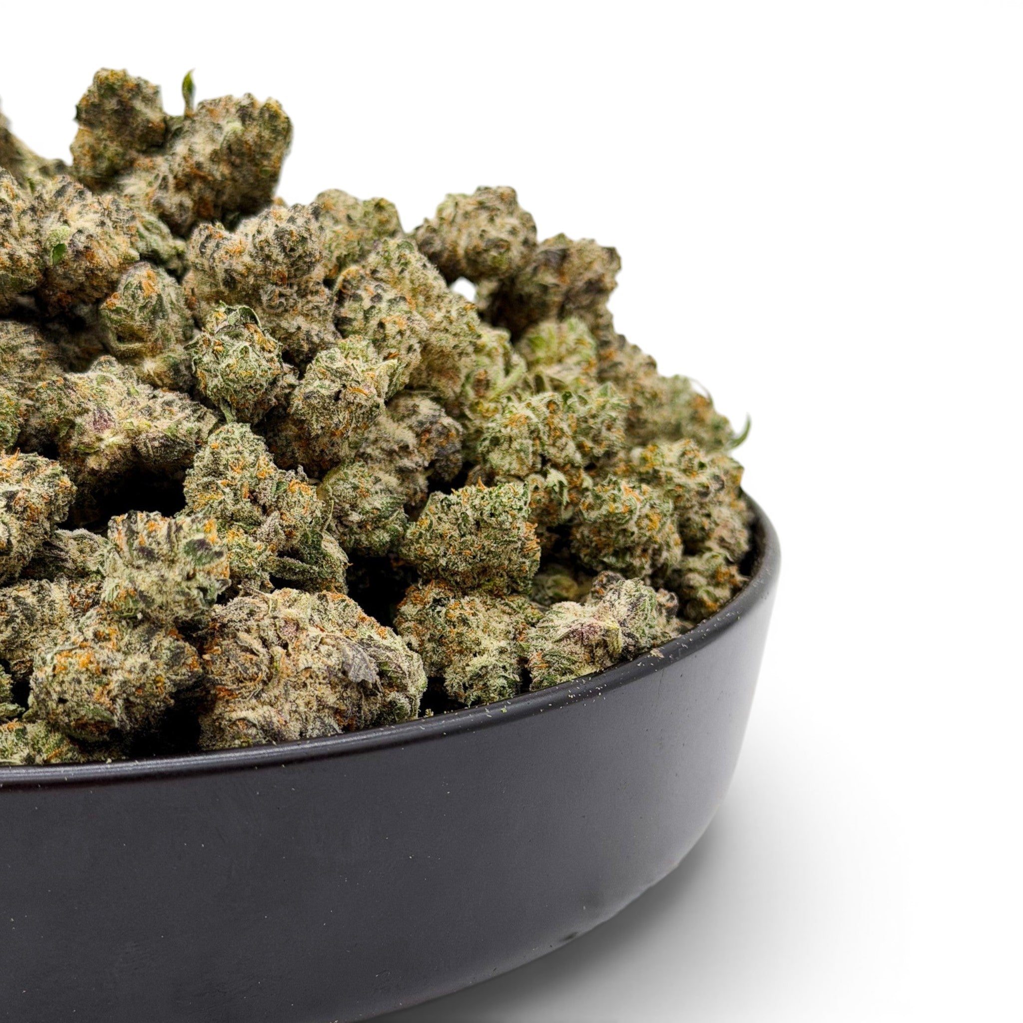 Dr. Wonderstone Secret Cookies THCa flower buds in a black bowl, featuring dense green nugs with orange pistils.