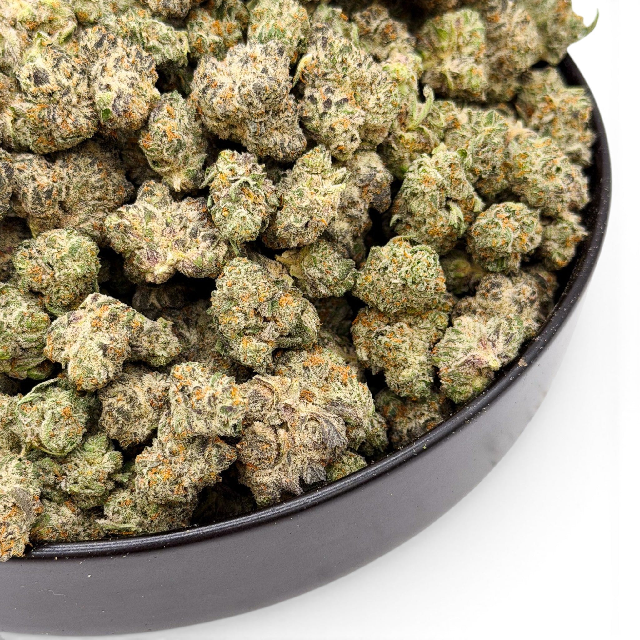 Dr. Wonderstone Secret Cookies THCa flower buds with frosty trichomes, green hues, and orange pistils in a black bowl.